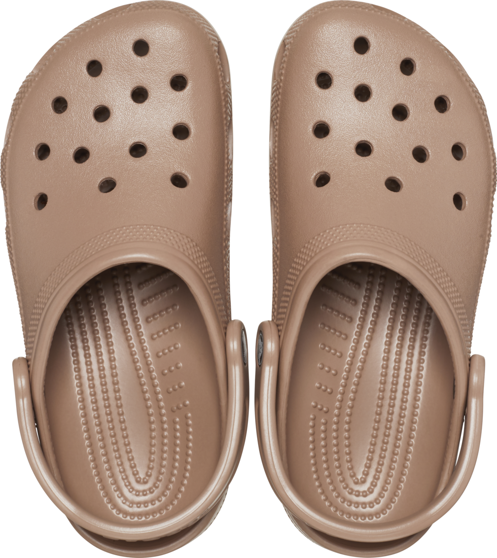 The Crocs Unisex Classic Clogs (10001-2Q9) in Latte by Crocs feature multiple ventilation holes and adjustable heel straps, offering comfortable, water-friendly everyday wear. Seen from above, these light brown clogs are designed for all-day comfort.