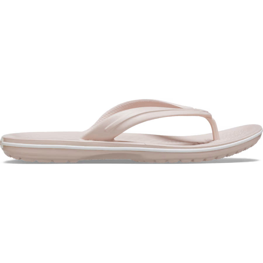 The Crocs Unisex Crocband Flip Flops (11033-6UR) in Quartz feature a light pink thong strap and textured sole, blending comfort and style—ideal for anyone seeking supportive flip flops from the Crocs brand.