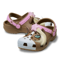 The Crocs Toddlers Classic IAM Horse Clogs (211371-2JJ) in Milk Chocolate feature a horse-inspired design with brown and white colors, cartoon eyes, pink stars, 3D ears, and a mane—easy-to-clean kids’ clogs perfect for fun adventures.