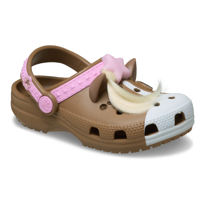 The Crocs Toddlers Classic IAM Horse Clogs (211371-2JJ) in Milk Chocolate feature playful horse details, a white toe, brown ears, pink strap with stars, pink star charm, and a blonde faux ponytail—fun and easy to clean for toddlers.