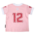 A light pink short-sleeve baby jersey shown from the back, featuring a large red number 12 with a white outline, white ribbed collar and sleeve cuffs, and small red details on the shoulders.