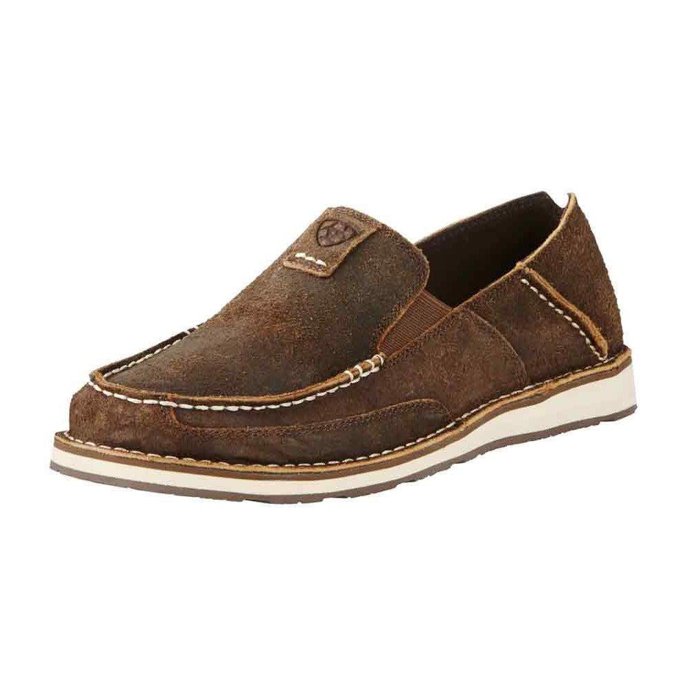 The Ariat Mens Cruiser Slip-on Shoes (10019871) in Rough Oak feature brown suede, white stitching, a tan rubber sole, and a logo patch on top—combining comfort with casual, rugged style for everyday wear.