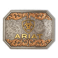 The Ariat Rectangle Raised Ariat Logo Buckle (A37054) in aged silver and gold features ornate floral engravings, a raised gold "ARIAT" text, and the iconic shield logo with horseshoe and star.