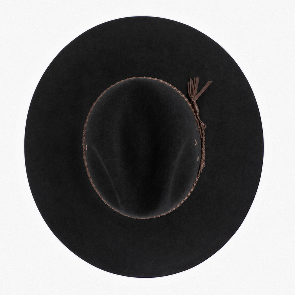 A black Avenel The Overflow hat shown from a top-down view, featuring a brown braided band, set against a plain white background.

