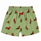 A pair of sage green Bamboozld Men's Weiner Bamboo Boxer Shorts (BBW22UBSWEINER) with an all-over print of brown dachshund dogs, featuring an elastic waistband and a button closure.