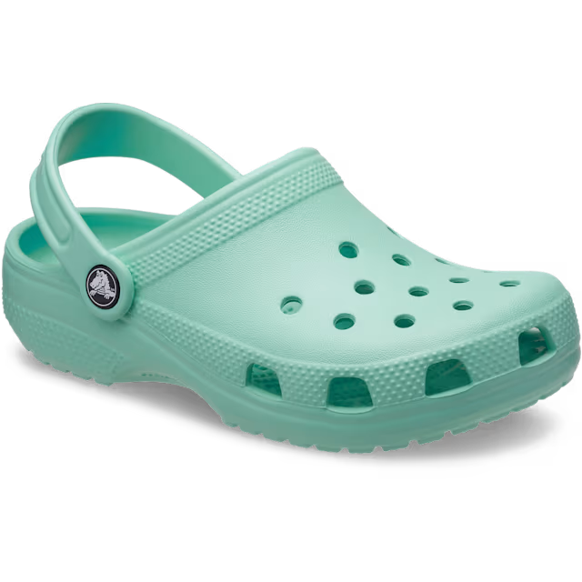 A single retro mint Crocs Children's Classic Clog (206991-5DV) with a textured sole, ventilation holes, and a small circular logo on the side strap, in 3-4 view shown against a plain white background.