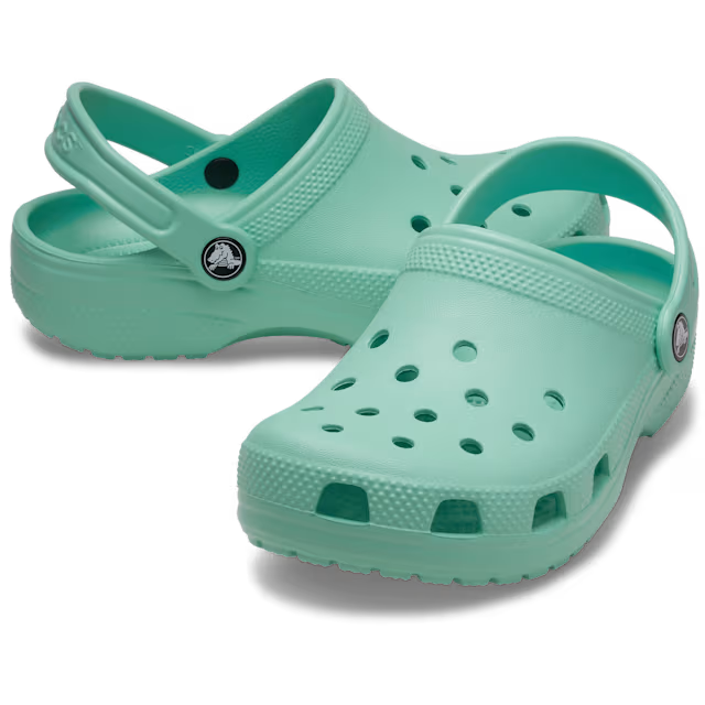 A pair of retro mint Crocs Children's Classic Clogs (206991-5DV) shown on a clean white background, with one clog in front and the other behind it.
