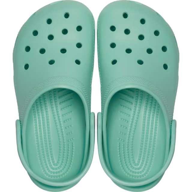 A pair of retro mint Crocs Children's Classic Clogs (206991-5DV) with circular ventilation holes, shown from a top-down view on a plain white background.