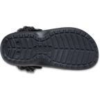 A sole of a black Crocs Children's Classic Fleece Lined Clog (212856-001) with fluffy dark grey faux-fur lining, shown on a clean white background.