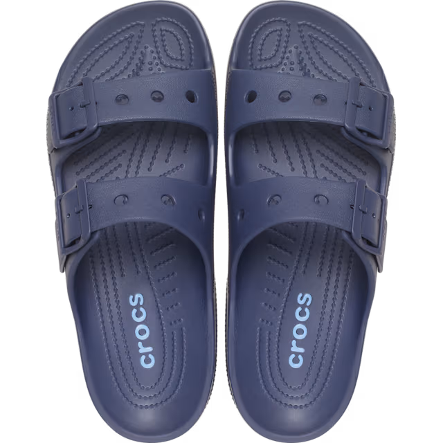 A pair of navy blue Crocs Men's Saturday Sandals (212245-410) double-strap slide sandals shown from a top-down view on a plain white background.