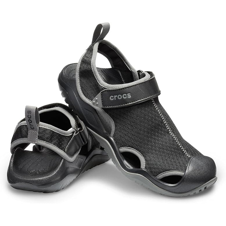A pair of black and grey Crocs Men's Swiftwater Mesh Deck Sandals (205289-001), displayed on a clean white background.