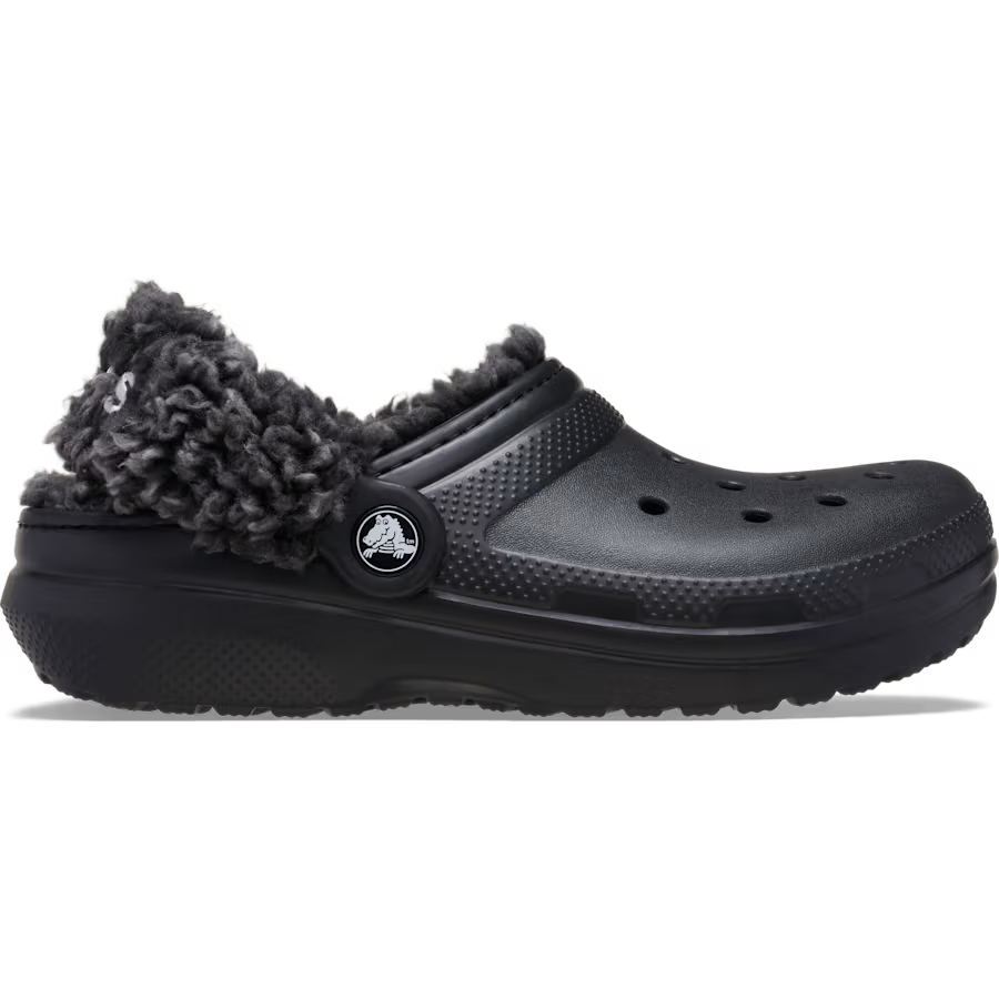 A side view of a black Crocs Toddlers Classic Fleece Lined Clog (212857-001) with fluffy dark grey sherpa lining, shown on a clean white background.
