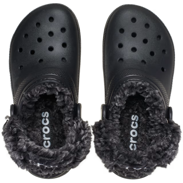 A pair of black Crocs Toddlers Classic Fleece Lined Clogs (212857-001) with fluffy dark grey sherpa lining, shown on a clean white background.