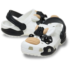 The Crocs Toddlers Classic IAM Cow Clogs (212902-100) in white feature a fun black and white cow design with 3D face, ears, snout, and spots—perfect for kids who love playful footwear.