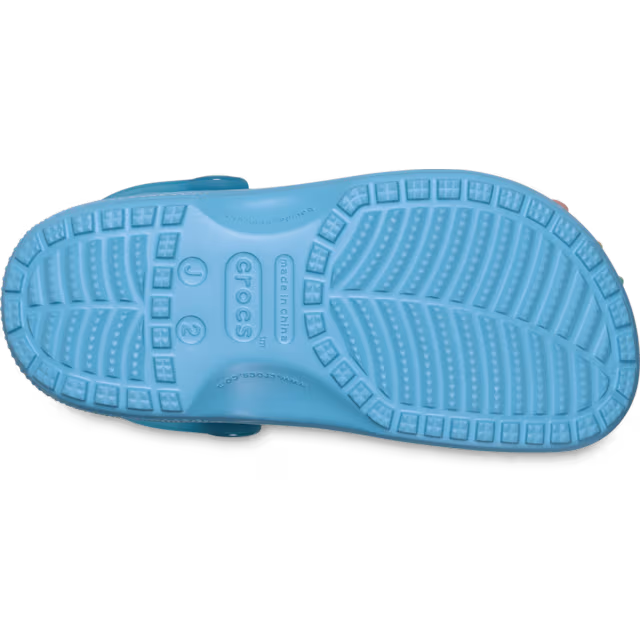 The sole of an Elite Blue Crocs Toddlers Classic Scented Snow Cone Clog (213182-5DU) on a white background.
