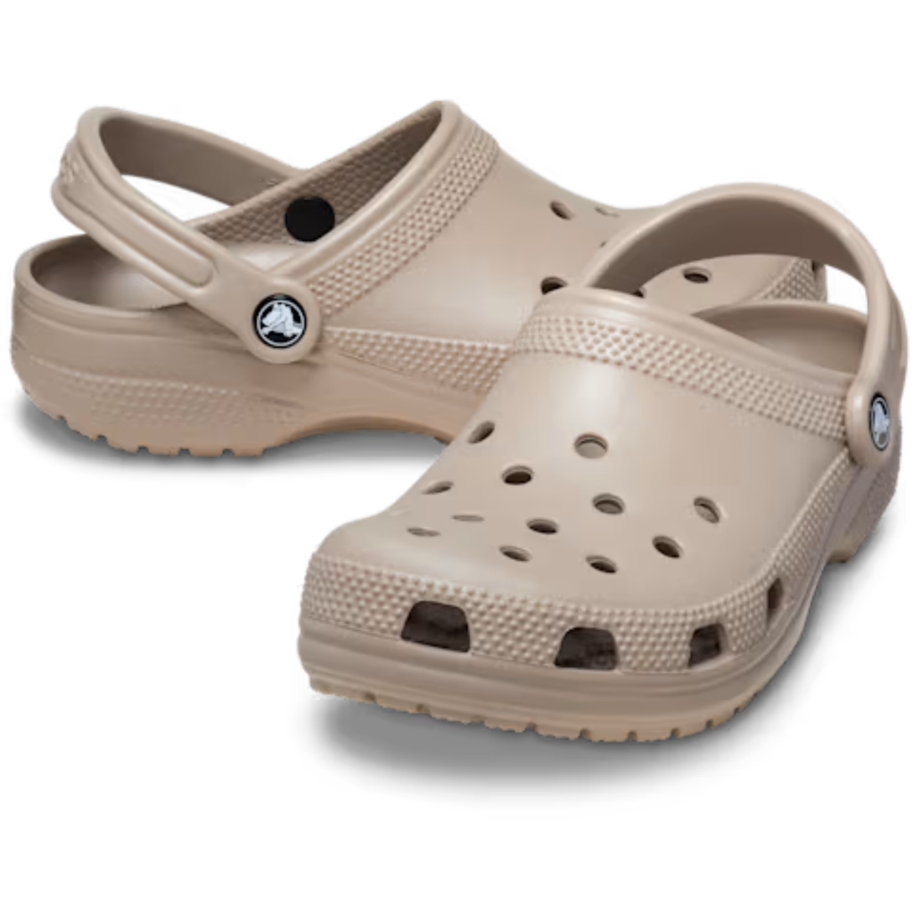 Crocs Unisex Classic Clogs (10001-214) in taupe by Crocs, with ventilation holes and adjustable heel straps, shown on a white background.