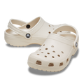 The Crocs Unisex Classic Clogs (10001-2MC) Frappe by Crocs are beige clogs with ventilation holes and adjustable heel straps, shown on a white background. Lightweight and comfortable, they’re ideal water-friendly footwear for daily use.