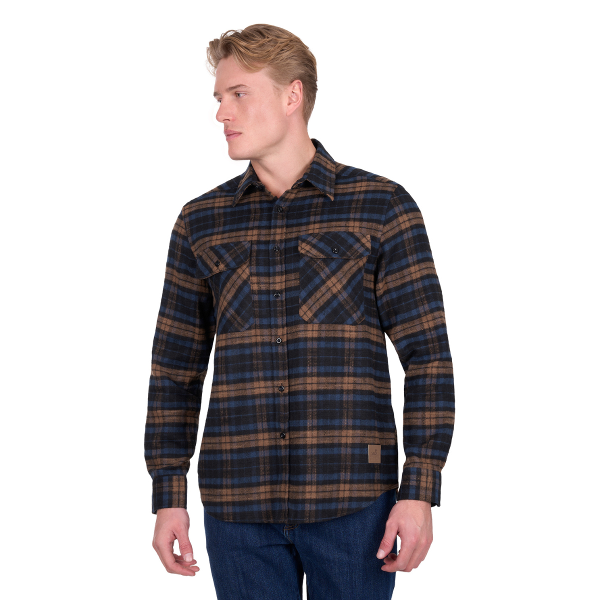 A man in blue jeans and light hair wears the Dux-Bak Mens Hunter L/S Thermal Shirt (D6W1116205) in Navy/Dark Tan, a long-sleeve, button-up check shirt with front pockets, as he stands looking to his left.