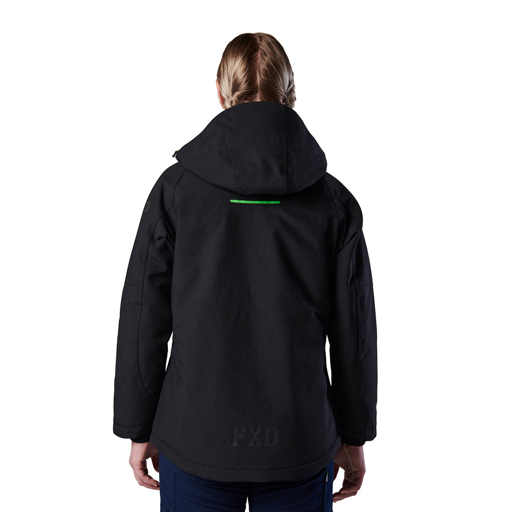 A woman viewed from the back modelling a black hooded FXD Women's WO-1W Insulated Waterproof Jacket (FX12407001) with a small green horizontal reflective strip near the top of the back and a tonal FXD logo near the lower back, against a plain white background.