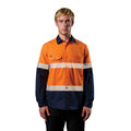 A man wearing an orange and navy FXD Men's LSH-4T Vented Tech Hi-Vis Long Sleeve Work Shirt (FX02504010) with hi vis tape and a pair of black work pants on a white background.