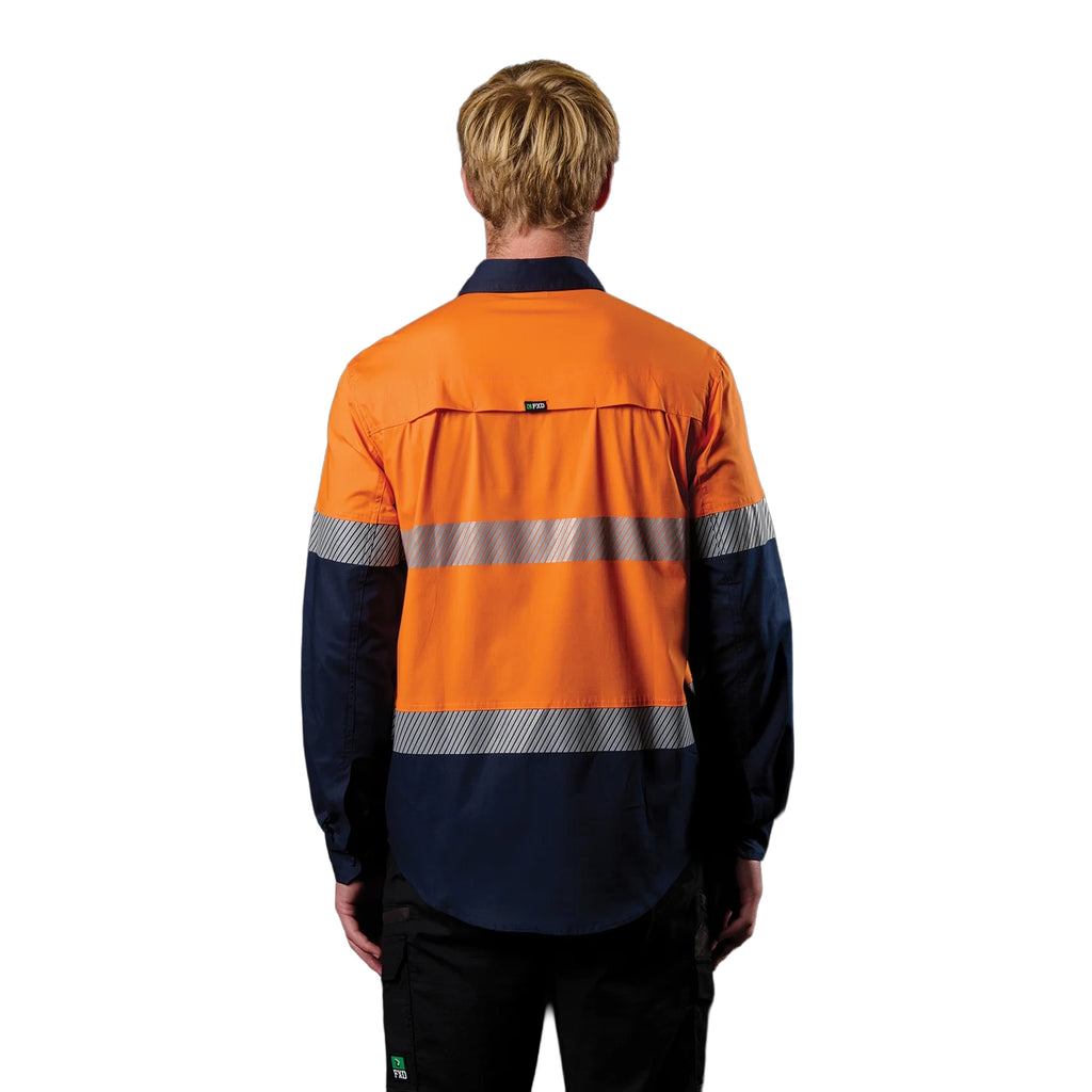 A back view of a man wearing an orange and navy FXD Men's LSH-4T Vented Tech Hi-Vis Long Sleeve Work Shirt (FX02504010) with hi vis tape and a pair of black work pants on a white background.