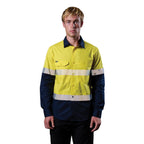 A man wearing a yellow and navy FXD Men's LSH-4T Vented Tech Hi-Vis Long Sleeve Work Shirt (FX02504010) with hi vis tape and a pair of black work pants on a white background.