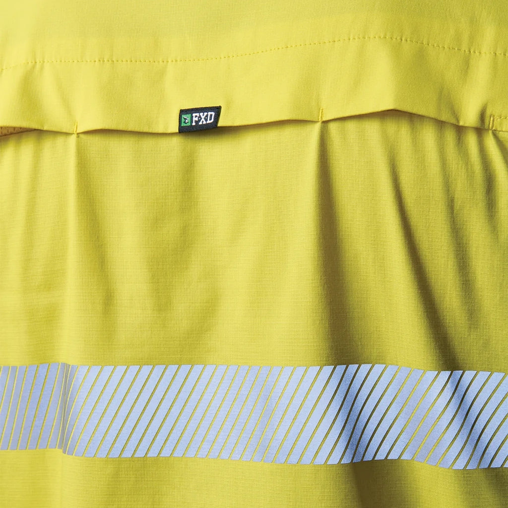 Close up detail of a yellow and navy FXD Men's LSH-4T Vented Tech Hi-Vis Long Sleeve Work Shirt (FX02504010) with hi vis tape on a white background.
