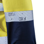 Close up detail of a yellow and navy FXD Men's LSH-4T Vented Tech Hi-Vis Long Sleeve Work Shirt (FX02504010) with hi vis tape on a white background.