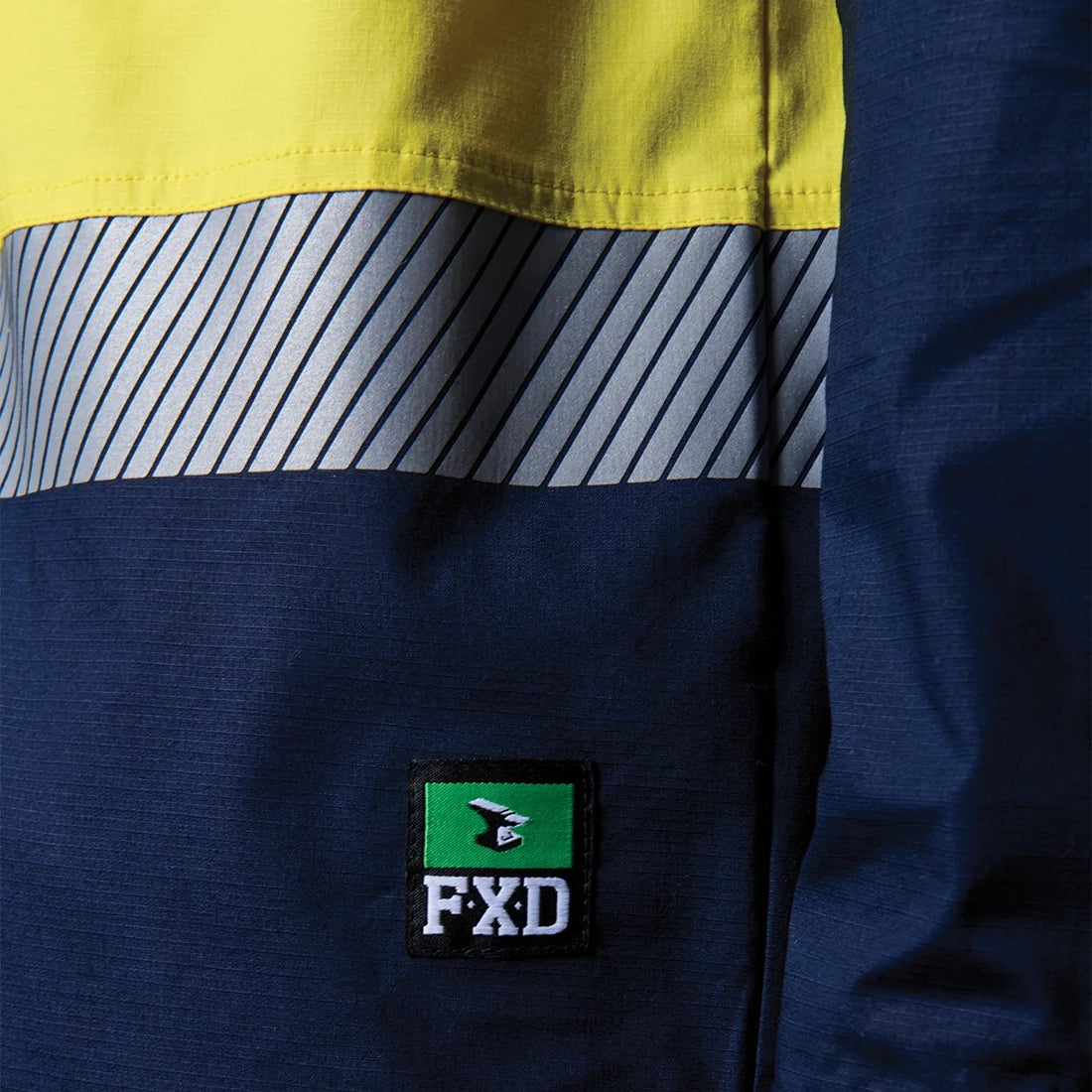 Close up detail of a yellow and navy FXD Men's LSH-4T Vented Tech Hi-Vis Long Sleeve Work Shirt (FX02504010).