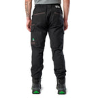 A man wearing black cargo style FXD WP-12C Elastic Waist Stretch Ripstop Cuffed Work Pants (FX02506027) with a drawstring waist and black work boots, shown from the waist down on a plain white studio background, from behind.