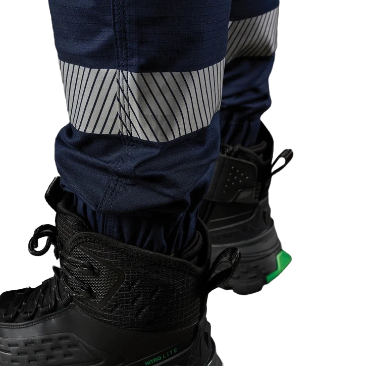 A close up showing the cuff and tape detail on a pair of navy FXD Men's WP-12CT Elastic Waist Stretch Ripstop Cuffed Taped Work Pants (FX02606029) on a white background.