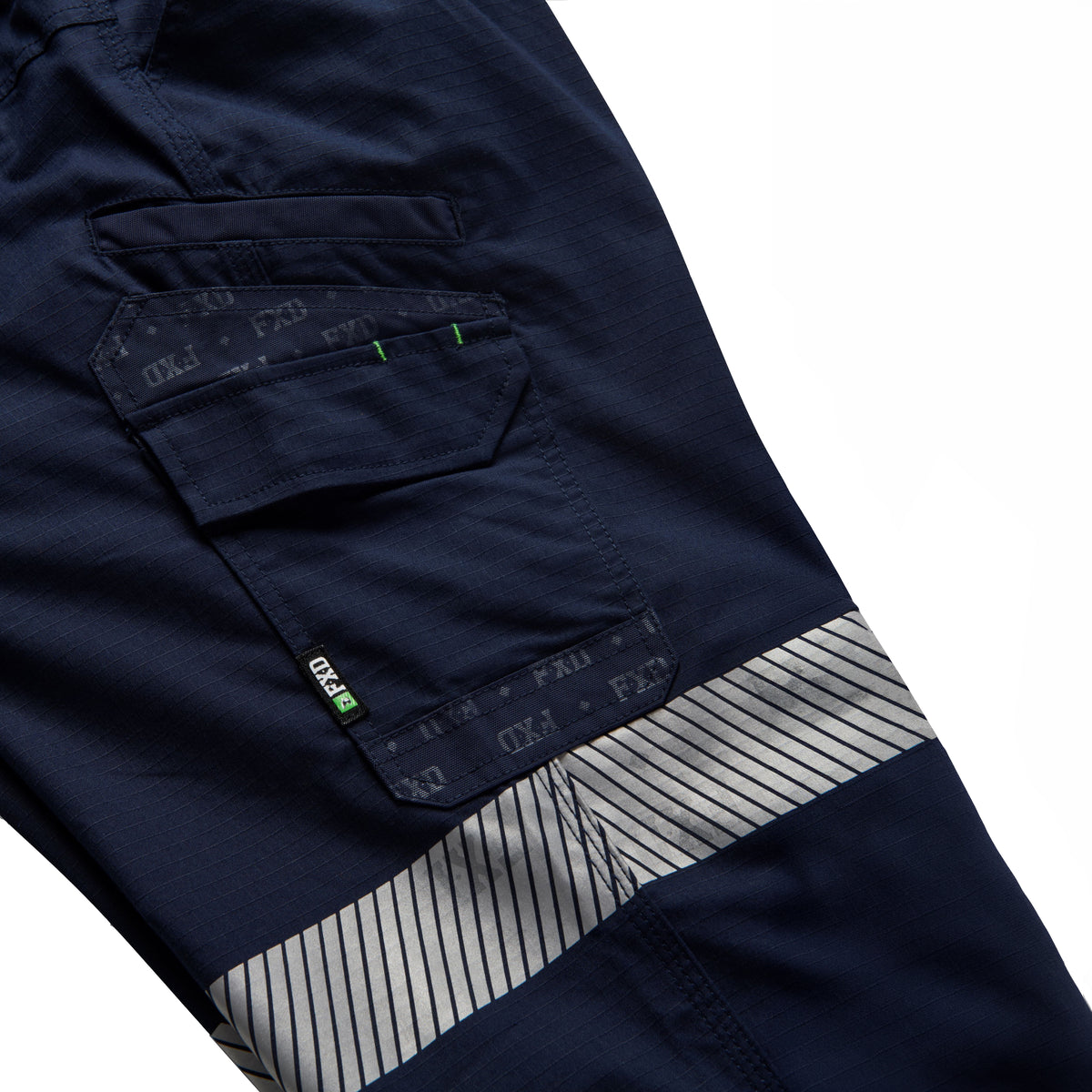A close up flat lay showing the pocket and tape detail on a pair of navy FXD Men's WP-12CT Elastic Waist Stretch Ripstop Cuffed Taped Work Pants (FX02606029) on a white background.