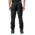 A back view of a man wearing black cargo style FXD Men's WP-12 Elastic Waist Stretch Ripstop Work Pants (FX02506026) with black work boots on a white background.
