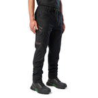 A 3-4 front view of a man wearing black cargo style FXD Men's WP-12 Elastic Waist Stretch Ripstop Work Pants (FX02506026) with black work boots on a white background.
