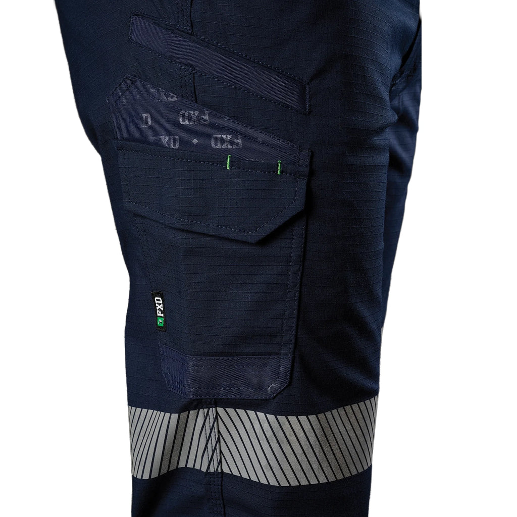 Close up right side pocket detail of a pair of navy blue FXD Men's WP-12T Elastic Waist Stretch Ripstop Taped Work Pants (FX02606028) on a white background.