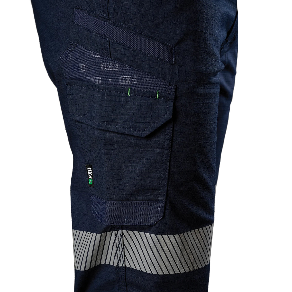 Close up right side pocket detail of a pair of navy blue FXD Men's WP-12T Elastic Waist Stretch Ripstop Taped Work Pants (FX02606028) on a white background.