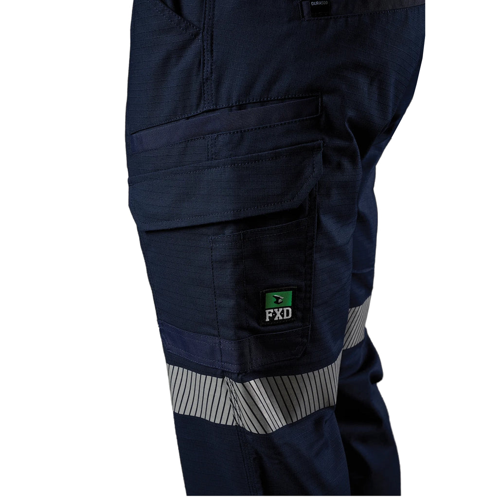Close up left side pocket detail of a pair of navy blue FXD Men's WP-12T Elastic Waist Stretch Ripstop Taped Work Pants (FX02606028) on a white background.