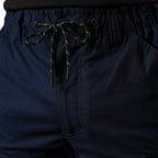Close up of the front detail of a pair of navy blue FXD Men's WP-12T Elastic Waist Stretch Ripstop Taped Work Pants (FX02606028) on a white background.