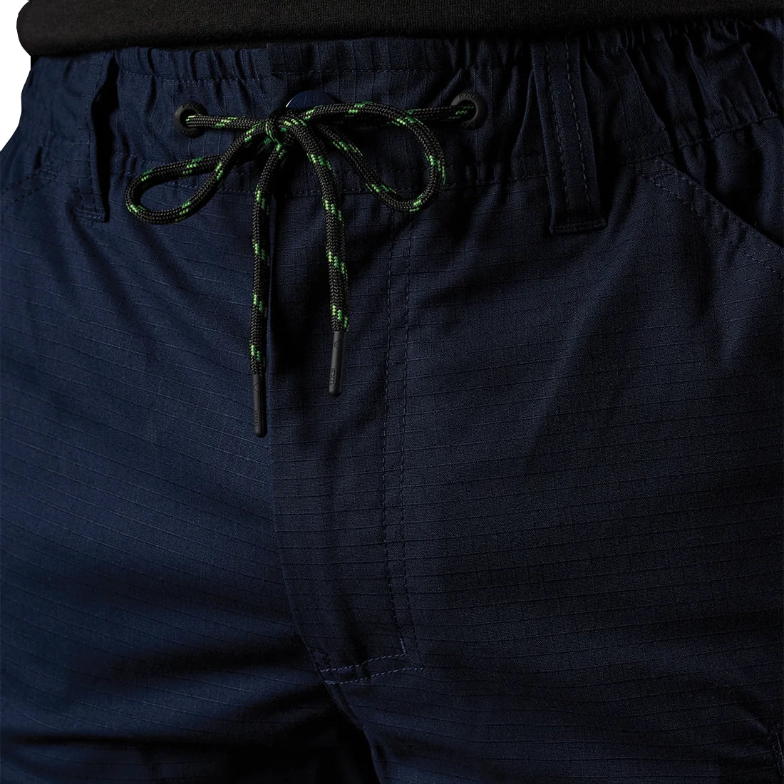 Close up of the front detail of a pair of navy blue FXD Men's WP-12T Elastic Waist Stretch Ripstop Taped Work Pants (FX02606028) on a white background.