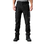 A man wearing black FXD Men's WP-4 Stretch Cuffed Work Pants (FX01616003) with cargo pockets and elastic cuffed ankles, paired with black work boots, shown against a plain white background.