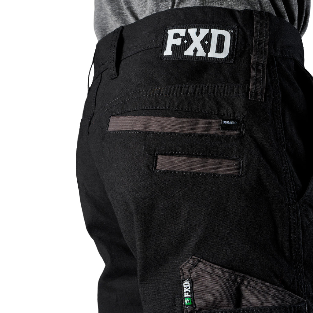 Close up pocket and waist detail on a pair of black FXD Men's WP-4 Stretch Cuffed Work Pants (FX01616003) with cargo pockets, shown against a plain white background.