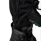Close up cuff detail on a pair of black FXD Men's WP-4 Stretch Cuffed Work Pants (FX01616003) with cargo pockets, shown against a plain white background.
