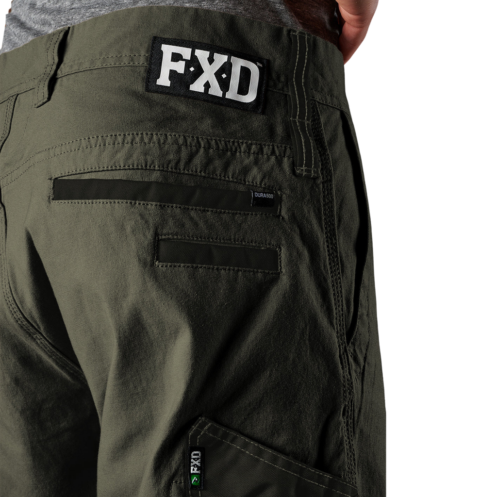 Close up waist and pocket detail on a pair of green FXD Men's WP-4 Stretch Cuffed Work Pants (FX01616003) with cargo pockets shown against a plain white background.
