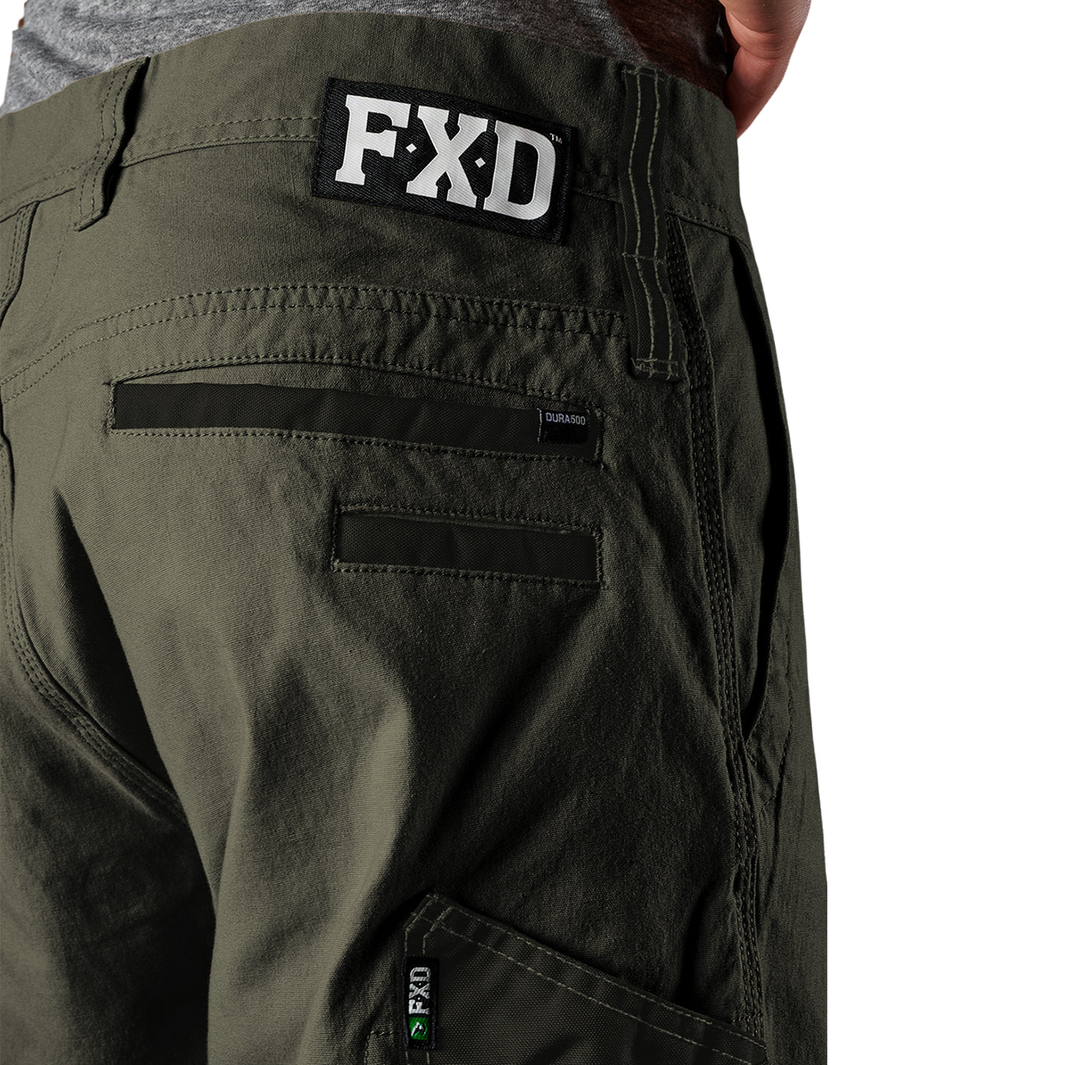 Close up waist and pocket detail on a pair of green FXD Men's WP-4 Stretch Cuffed Work Pants (FX01616003) with cargo pockets shown against a plain white background.