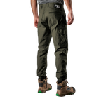 A man viewed from behind wearing green FXD Men's WP-4 Stretch Cuffed Work Pants (FX01616003) with cargo pockets and elastic cuffed ankles, paired with wheat coloured work boots, shown against a plain white background.