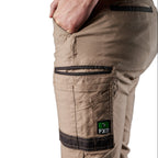 Close up pocket detail on a pair of khaki FXD Men's WP-4 Stretch Cuffed Work Pants (FX01616003) with cargo pockets, shown against a plain white background.