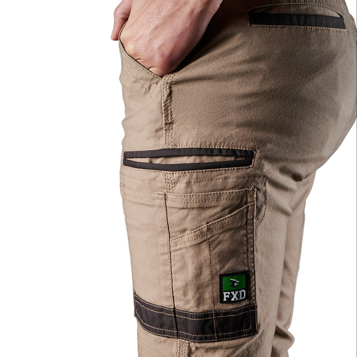 Close up pocket detail on a pair of khaki FXD Men's WP-4 Stretch Cuffed Work Pants (FX01616003) with cargo pockets, shown against a plain white background.