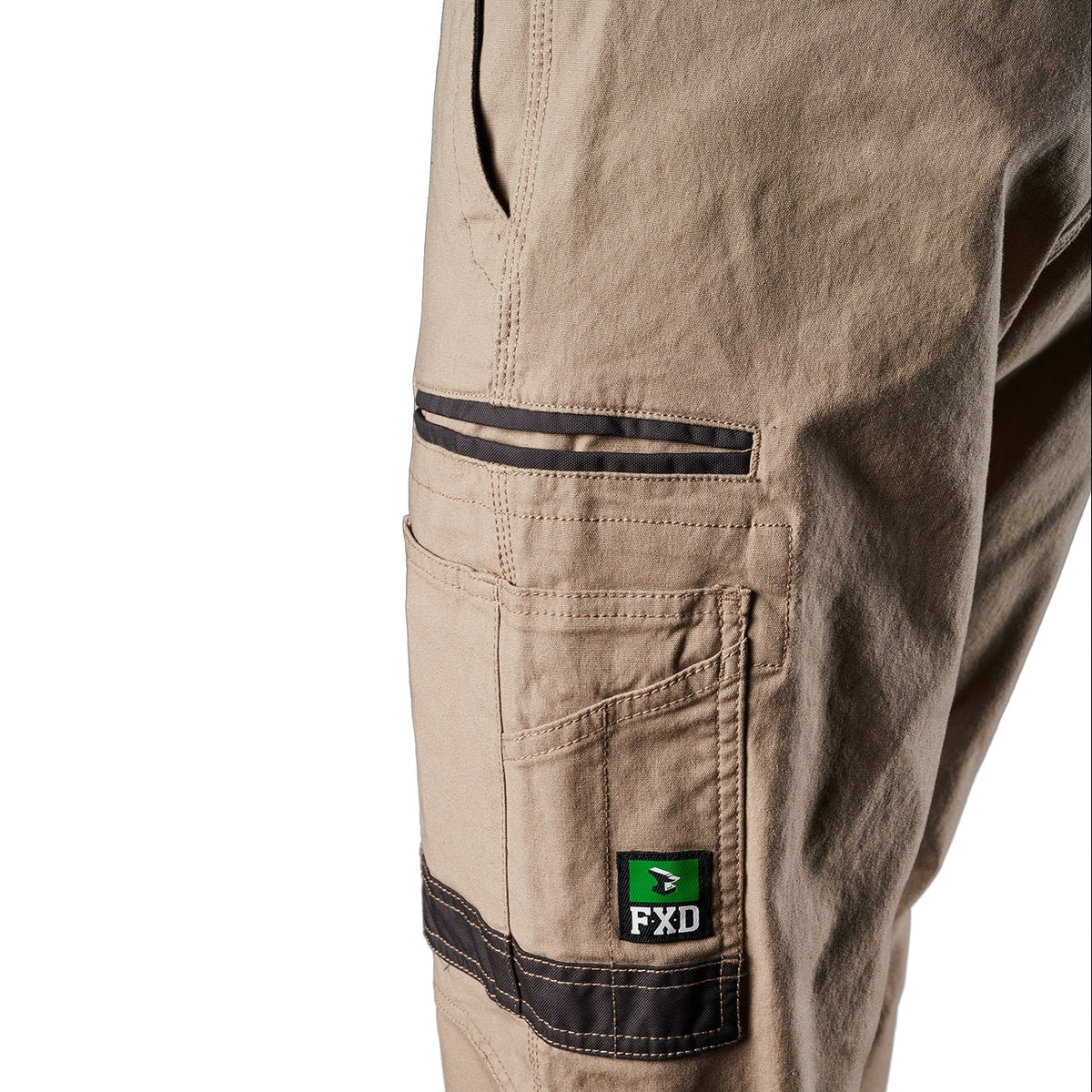 Close up pocket detail on a pair of khaki FXD Men's WP-4 Stretch Cuffed Work Pants (FX01616003) with cargo pockets, shown against a plain white background.