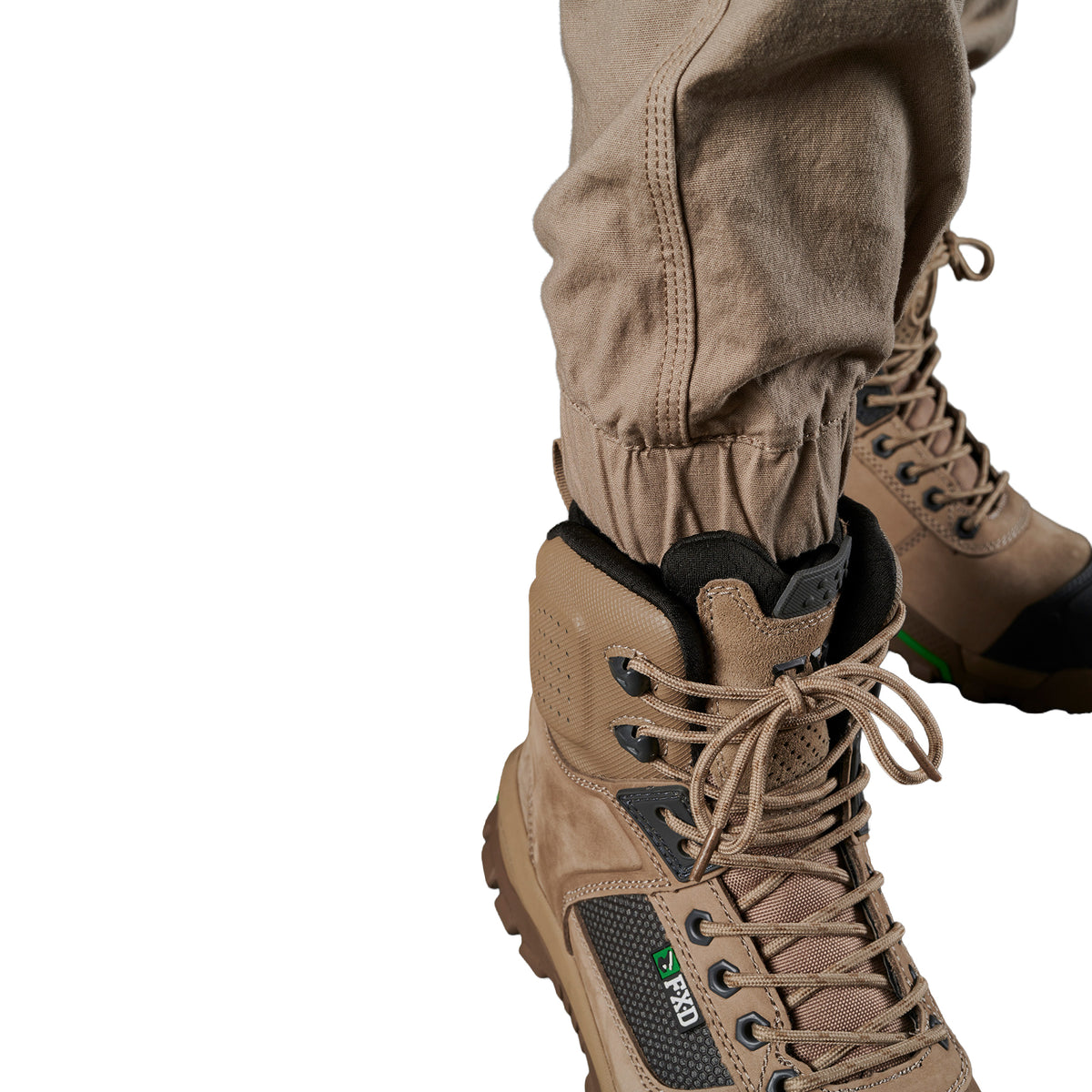 Close up cuff detail on a pair of khaki FXD Men's WP-4 Stretch Cuffed Work Pants (FX01616003) with cargo pockets, shown against a plain white background.