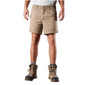 A man modelling a pair of khaki FXD Men's WS-2 Work Shorts (FX01136005) paired with grey socks, and stone FXD work boots against a plain white background.